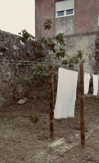 Extra long WAY white beach towel hanging to air dry
