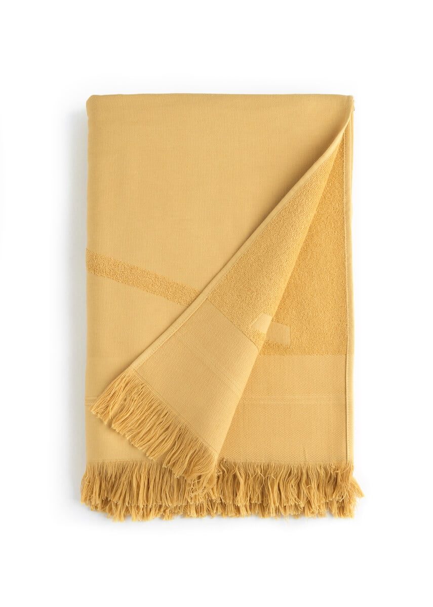 Folded yellow WAY beach towel with woven front and terry back and fringes