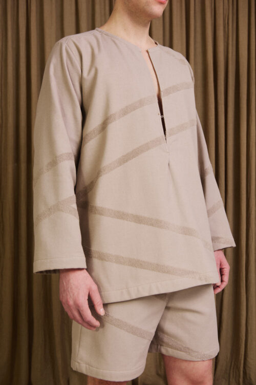 Grey Kaftan on male model close-up