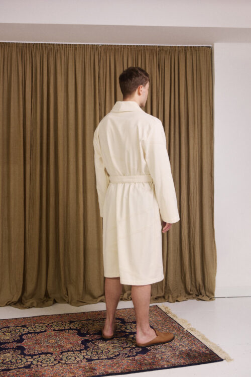 WAY unisex Marin Bathrobe in cream white on male model in front of a curtain in a bungalow mansion