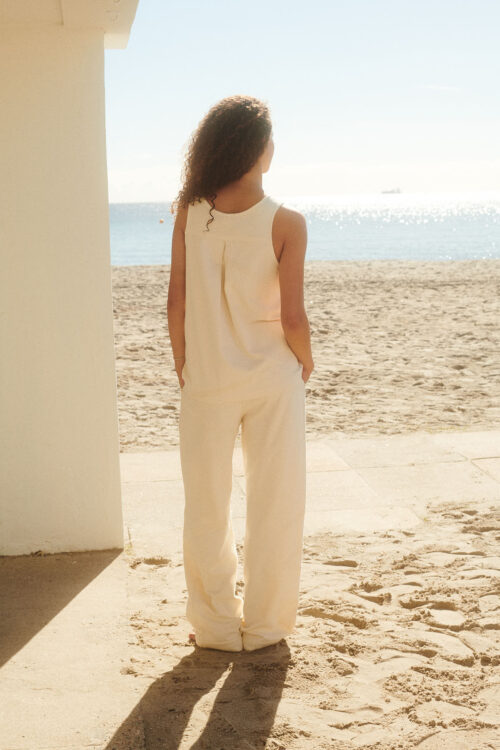 WAY Elba Pants in Shell cream white on female model back short on beach