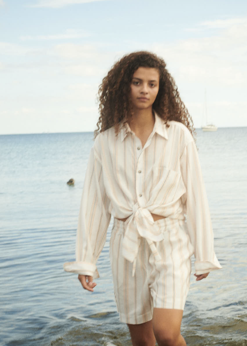Saona Shorts from WAY on female model in water by the beach