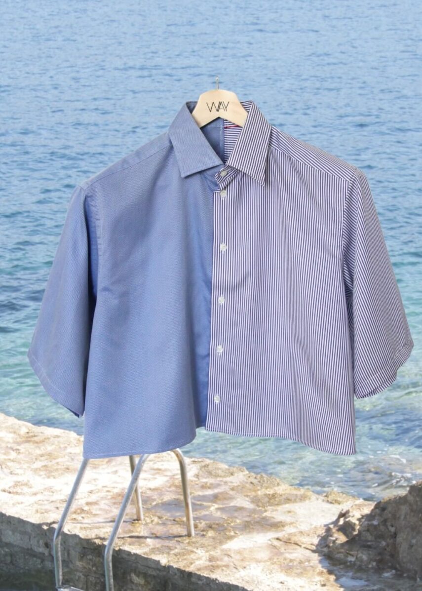 Upcycled blue striped SUN Crop Shirt from WAY collaboration with Salvation Army with ocean back ground