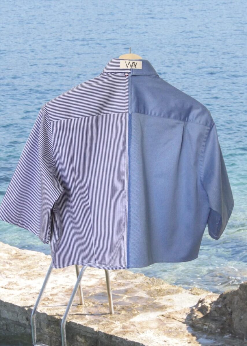 Upcycled blue striped SUN Crop Shirt from WAY collaboration with Salvation Army with ocean back ground